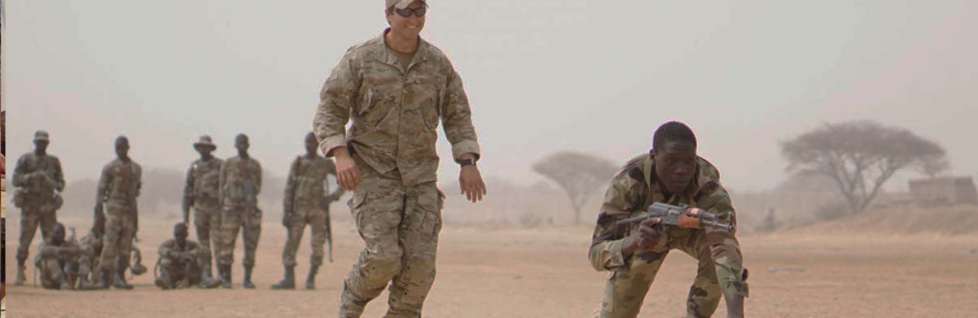 Special Forces personnel training in a field environment