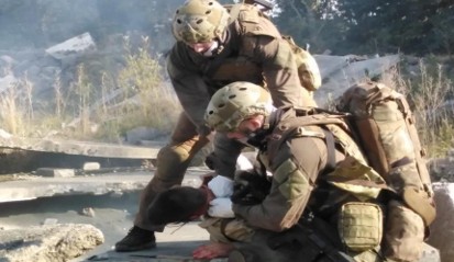 Tactical medical team practicing casualty treatment
